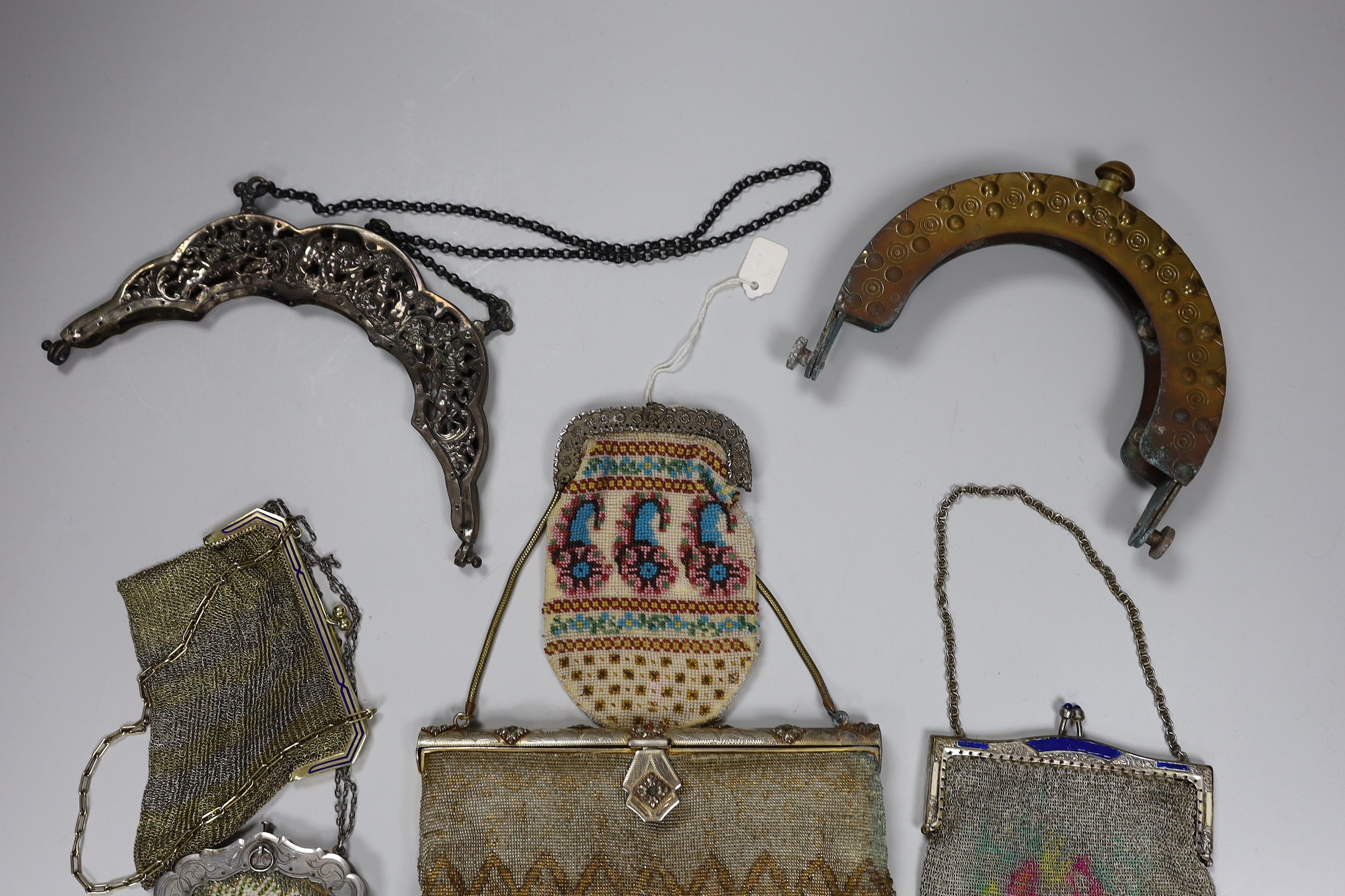 Two chain mail Edwardian handbags with enamelled frames, two 19th century beaded purses and a bag with ornate metal frames and two 20th century large metal bag frames (6)